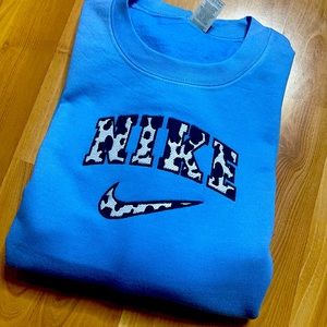 Inspired cow print embroidered crewneck